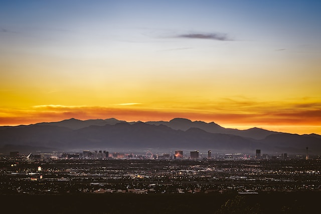 Photo by Ryan Hafey sunset image of Las Vegas skyline and mountains